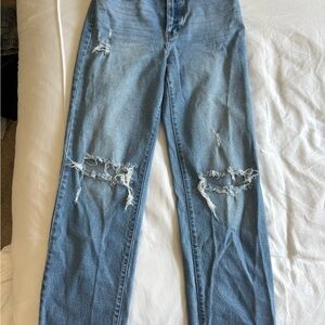 Distressed Blue Jeans. Medium wash